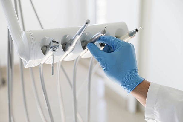 Professional Tooth Extraction technician working in Elkins, AR
